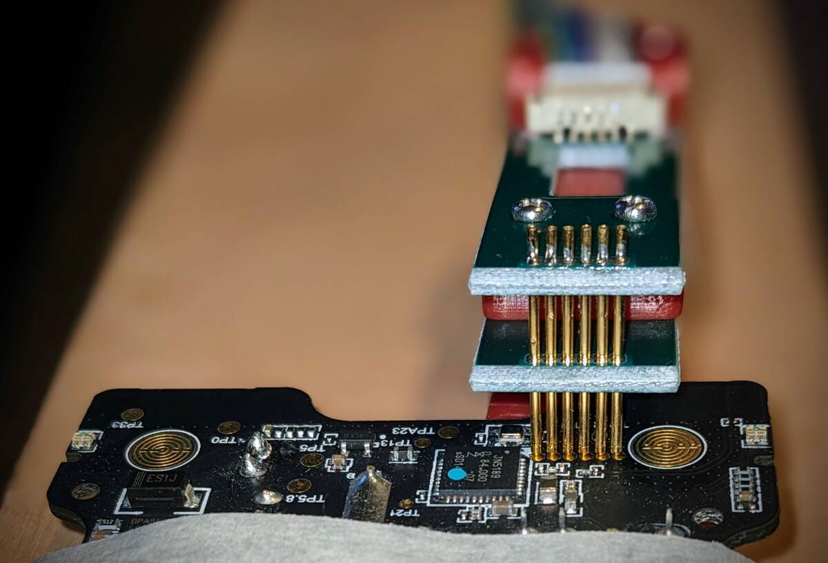 Pogo pin clamp connected to the ISP header on the PCB